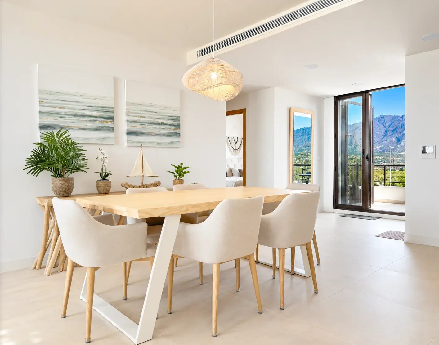Dining area with mountain views through floor-to-ceiling terrace doors