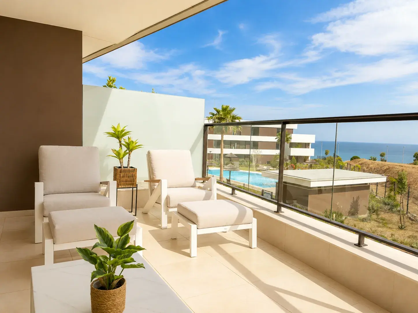 Private terrace with sea views over the community pool on the Costa del Sol — Estepona Golf Retreat, Casares Costa
